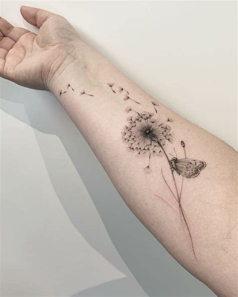 dandelion hand tattoo